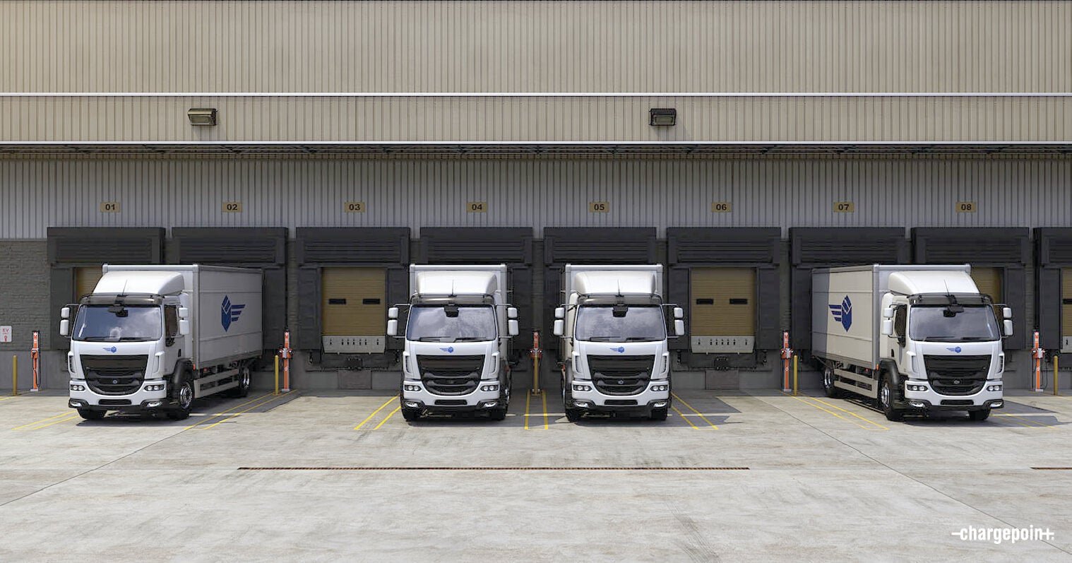 Electric delivery fleet vehicles in depot