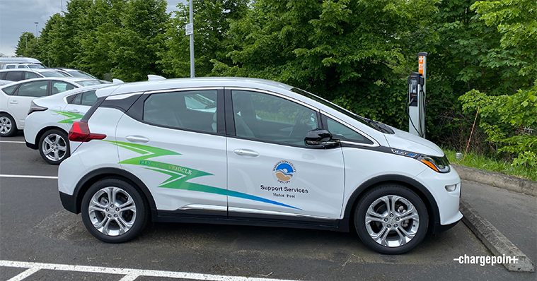 Municiple electric fleet vehicle plugged into ChargePoint charger