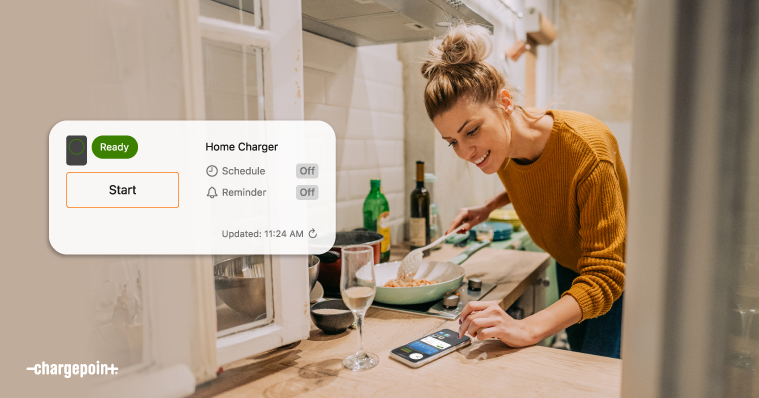 Person checking their phone to charging status via ChargePoint driver app