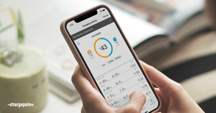 Person holding a mobile phone and viewing ChargePoint app