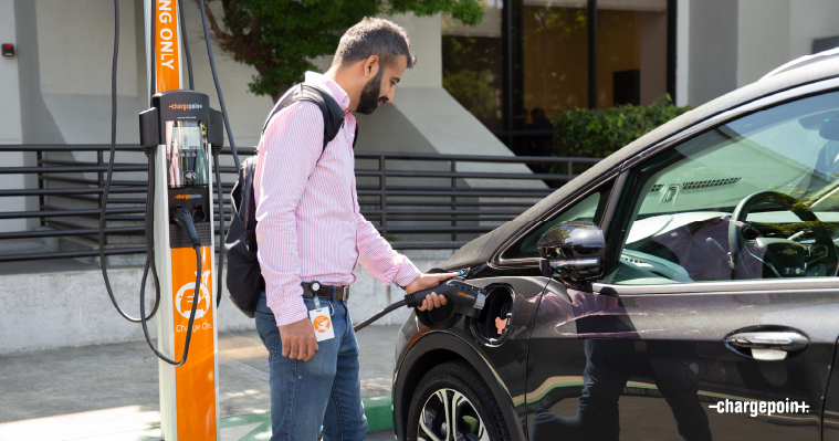 Person charging their car using ChargePoint CT4000