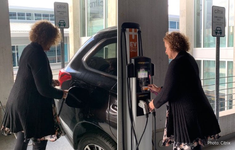 Woman using ChargePoint station at Citrix