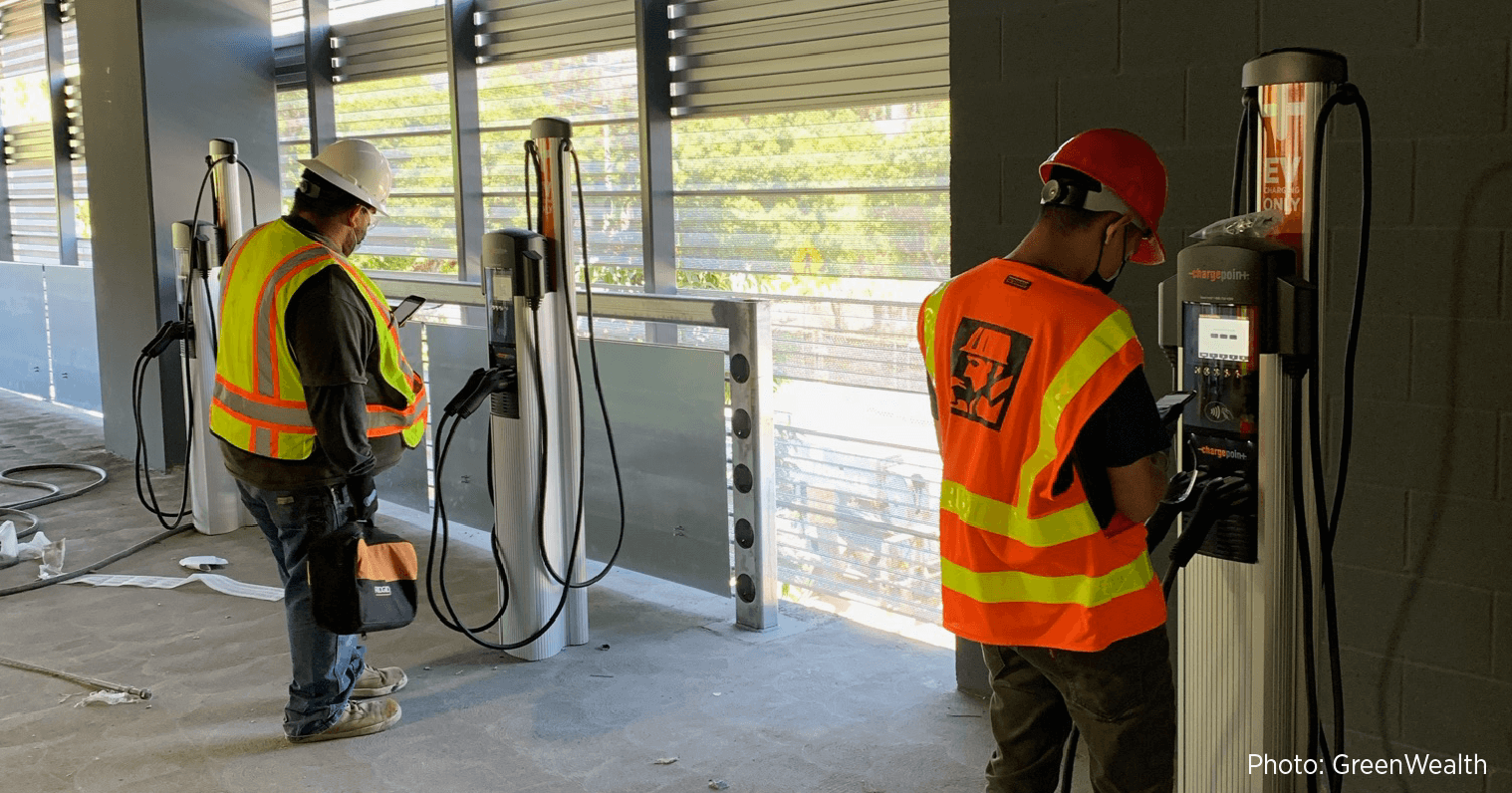 GreenWealth team installing ChargePoint chargers at a job site