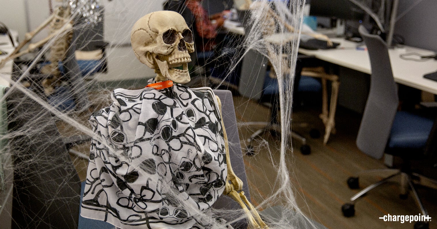 Skeleton working away at his desk