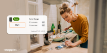 Person checking their phone to charging status via ChargePoint driver app
