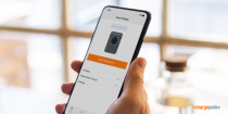 Person holding mobile phone with ChargePoint app on it