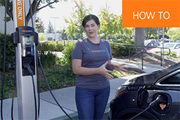 Person explaining how to charge on ChargePoint CT4000