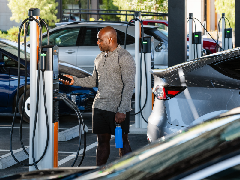 Person tapping on ChargePoint CP6000