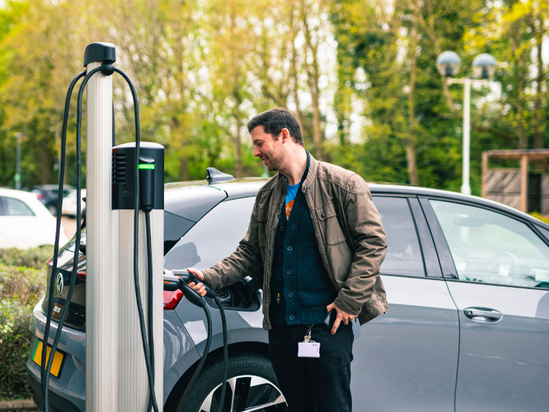 Person tapping on ChargePoint CP6000