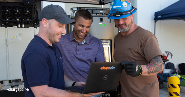 People giving service on ChargePoint station