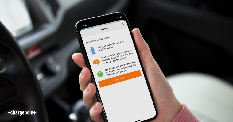 Hand holding a phone with the ChargePoint Waitlist screen on it