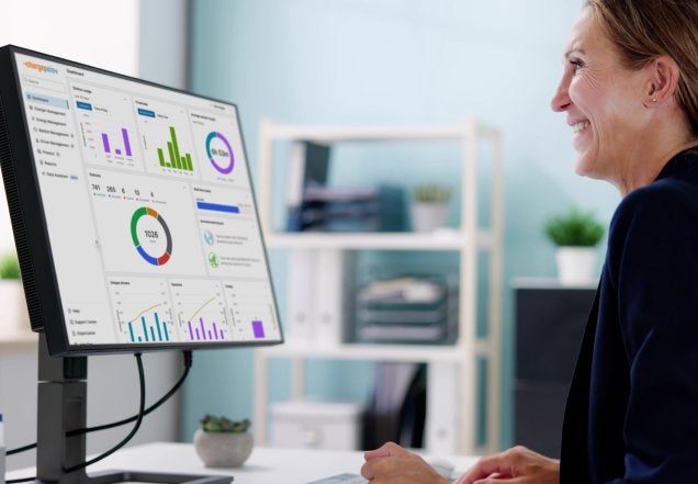 Person in front of a computer using ChargePoint Platform