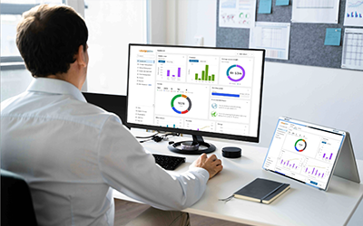 Person in front of a computer using ChargePoint Platform