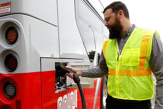 Person charging bus Person charging bus