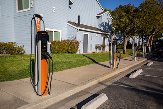 EV charger stations outside an apartment building EV charger stations outside an apartment building