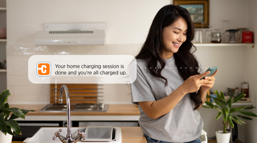 Person getting notification from ChargePoint app on their phone