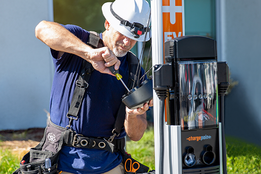 Person installing ChargePoint station Person installing ChargePoint station