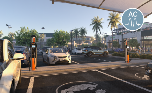 Electric vehicle charging stations in a parking lot with palm trees and a mall in the background. Electric vehicle charging stations in a parking lot with palm trees and a mall in the background.