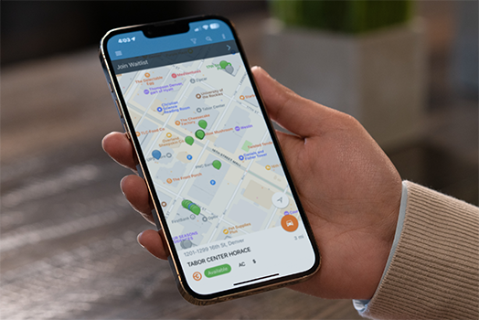 Hand holding a phone with ChargePoint app on it Hand holding a phone with ChargePoint app on it