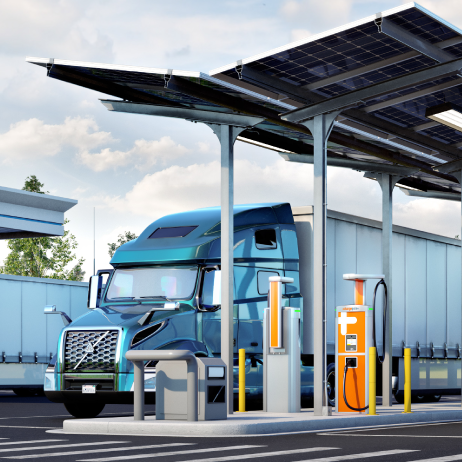 Electric vehicle charging stations under a solar canopy in a parking lot