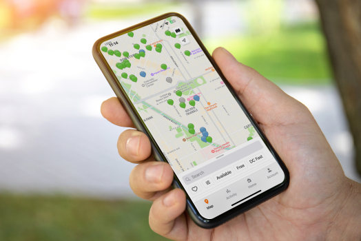Person viewing ChargePoint App on mobile phone Person viewing ChargePoint App on mobile phone